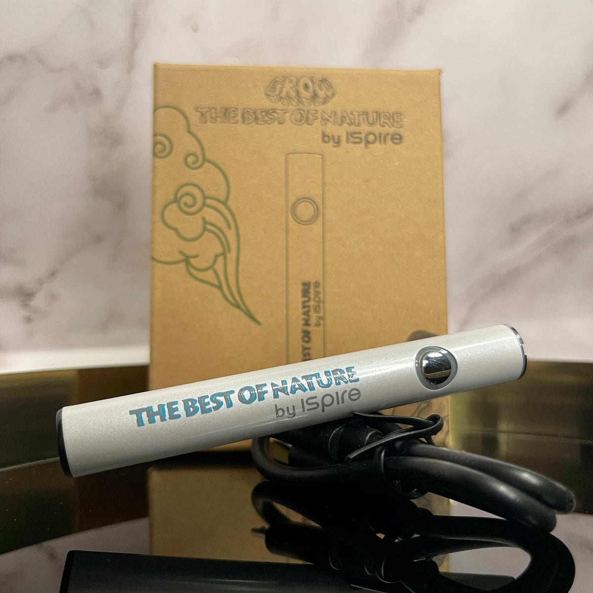 Batterie Pen ISPIRE 3.0 — batterie posée devant son emballage